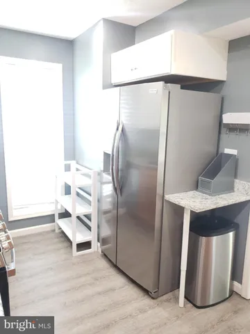 a kitchen with stainless steel appliances a refrigerator and a sink