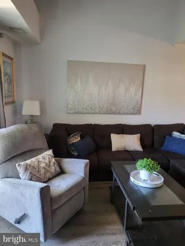 a living room with furniture and a couch