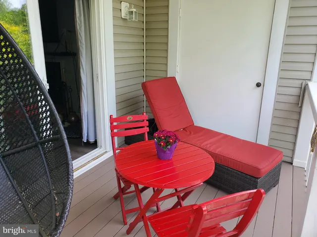 a view of a balcony with chairs