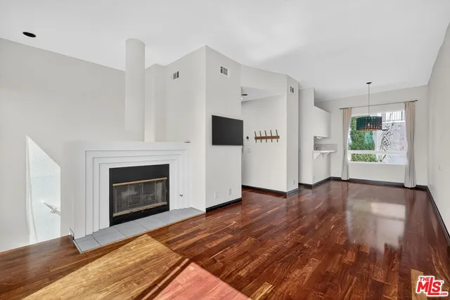 a view of a livingroom with wooden floor