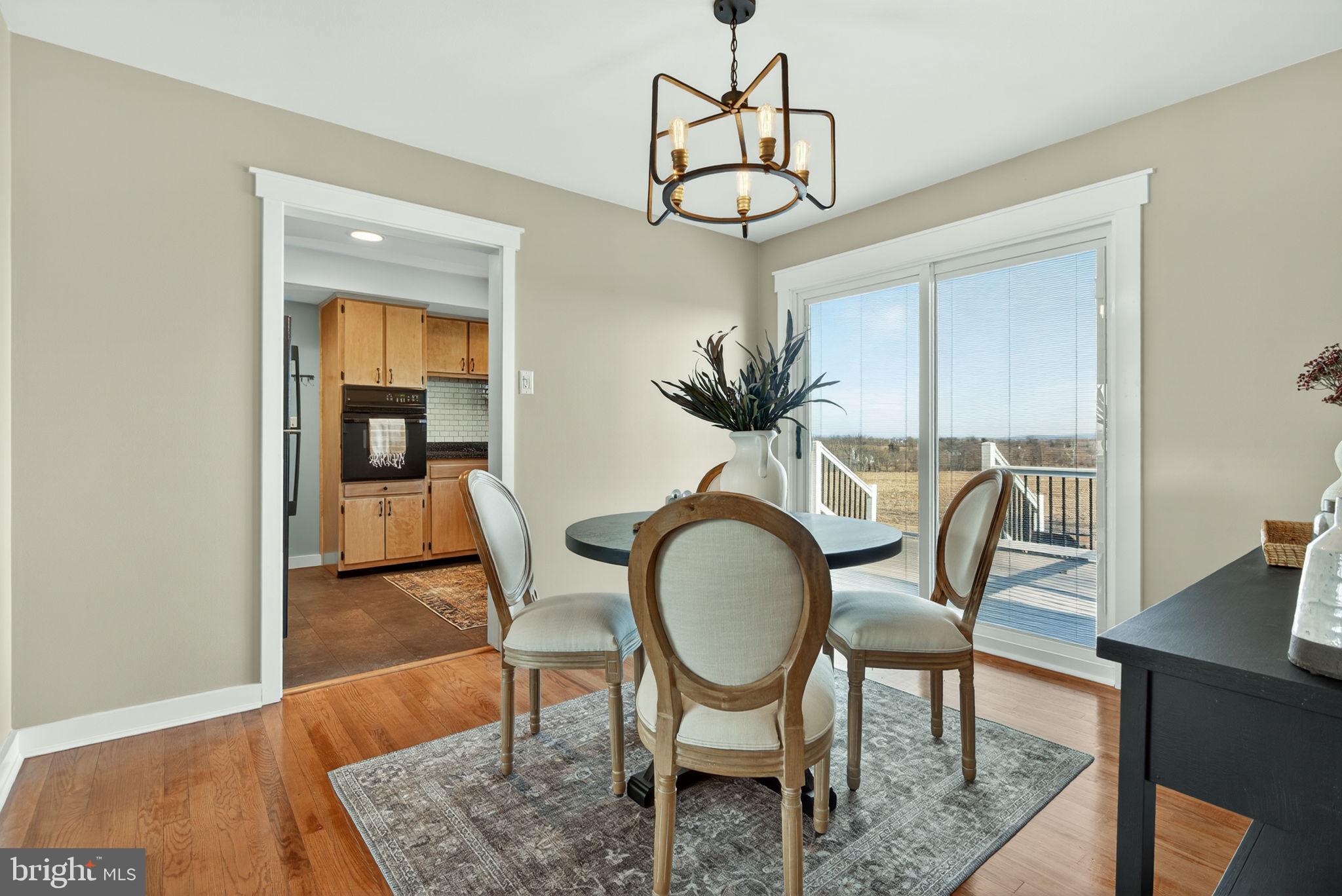 2103 South View Road Lancaster, PA 17602 - Photo 8 of 35 a view of a dining room with furniture wooden floor and chandelier