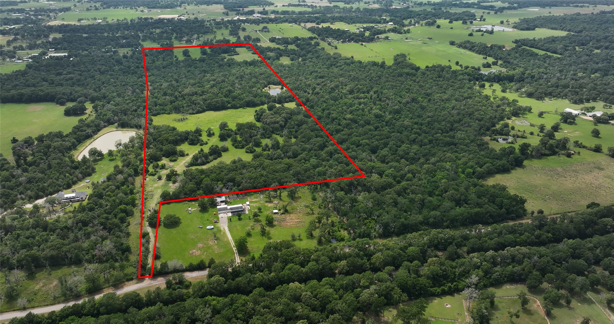 27296 Rock Island Road Hempstead, TX 77445 - Photo 11 of 30 an aerial view of green landscape with trees houses and green space