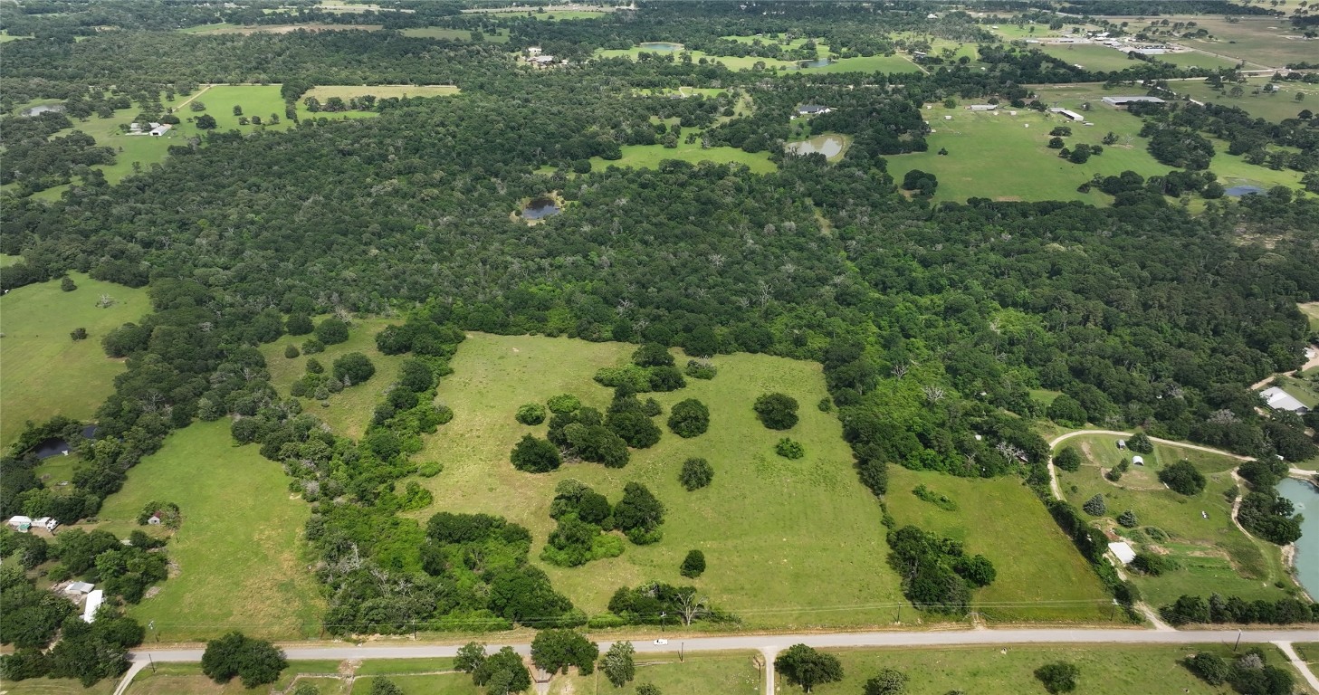 27296 Rock Island Road Hempstead, TX 77445 - Photo 21 of 30 an aerial view of a residential houses with yard