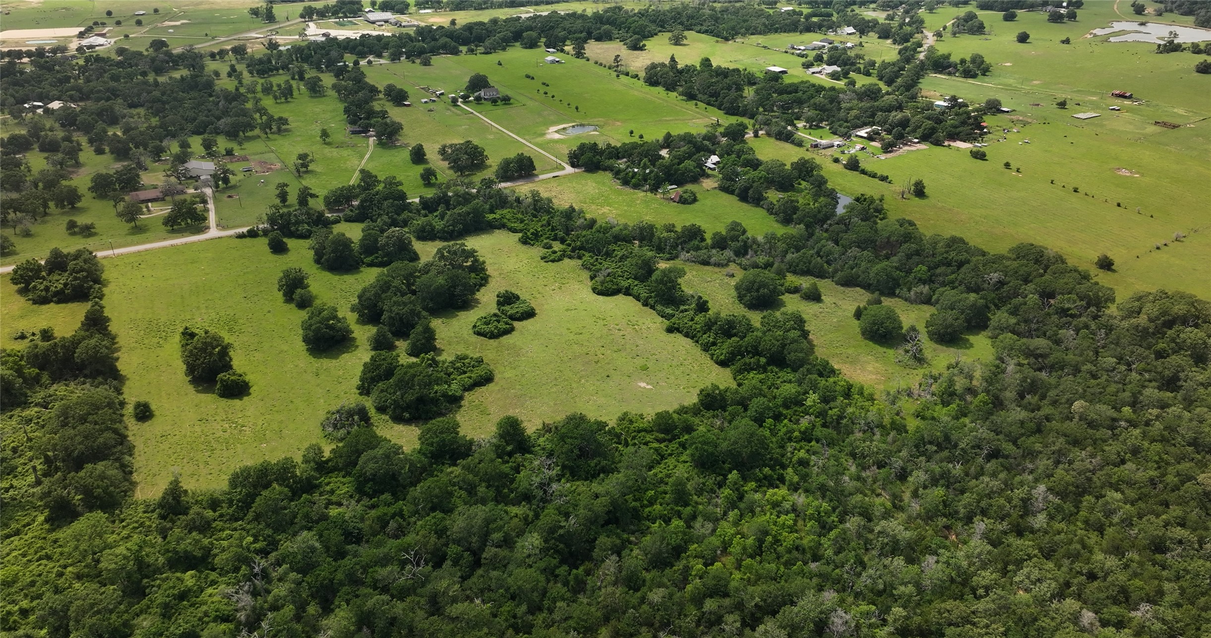 27296 Rock Island Road Hempstead, TX 77445 - Photo 22 of 30 an aerial view of a residential houses with yard