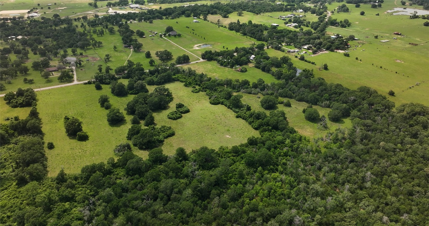 27296 Rock Island Road Hempstead, TX 77445 - Photo 22 of 30 an aerial view of a residential houses with yard