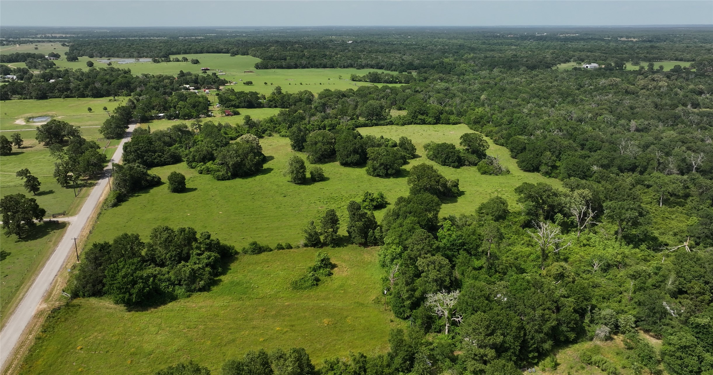 27296 Rock Island Road Hempstead, TX 77445 - Photo 24 of 30 an aerial view of a house with a yard