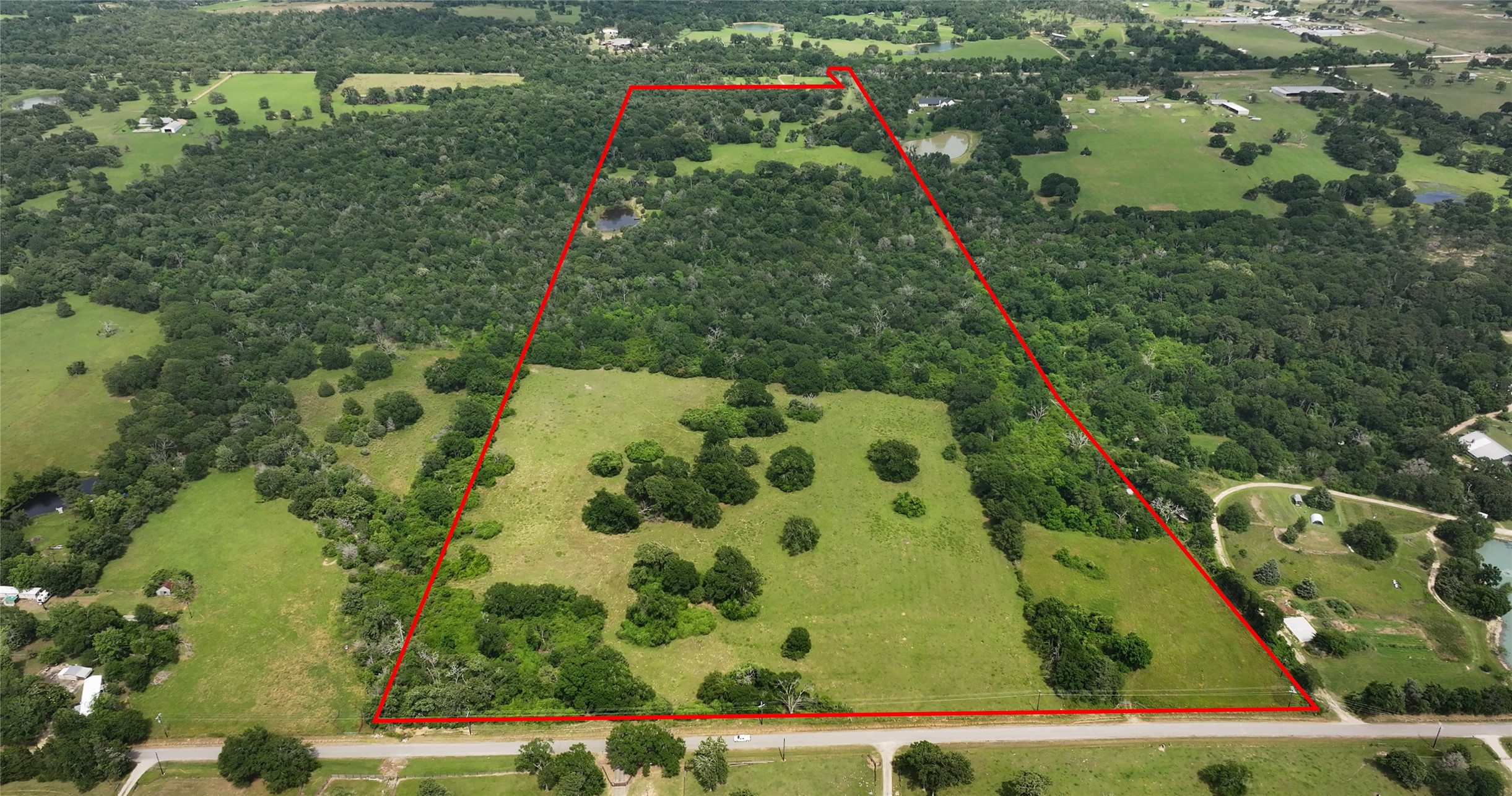 27296 Rock Island Road Hempstead, TX 77445 - Photo 3 of 30 an aerial view of residential houses with outdoor space