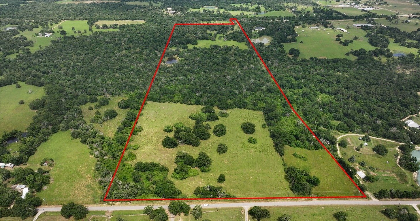 27296 Rock Island Road Hempstead, TX 77445 - Photo 3 of 30 an aerial view of a residential houses with yard