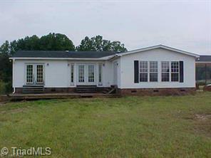 This Picture Taken Before Leland Cypress Grew Up Creating Shade.  Also Doors Taken Out & Window Added When Office Was Created Behind