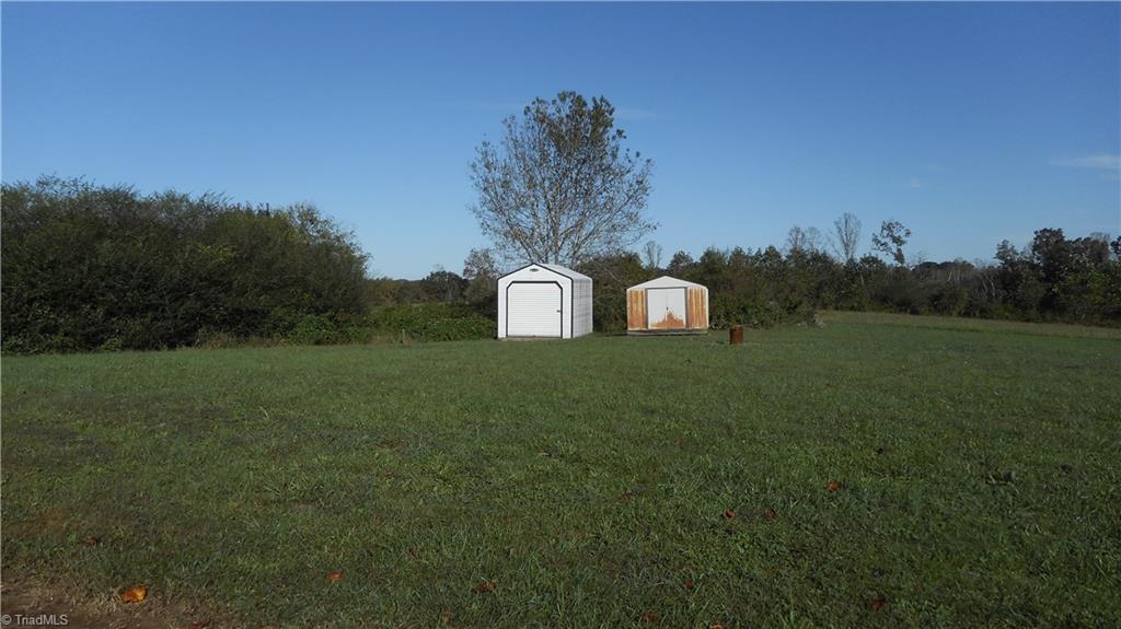 2621 Baltimore Road East Bend, NC 27018 - Photo 36 of 37 Large Rear Yard & 2 Storage Buildings