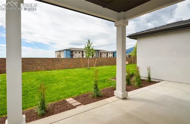 an aerial view of residential building and trees