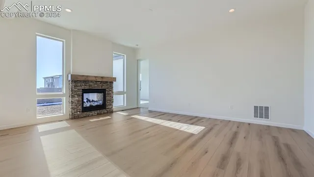 a kitchen with stainless steel appliances a sink a counter space and cabinets