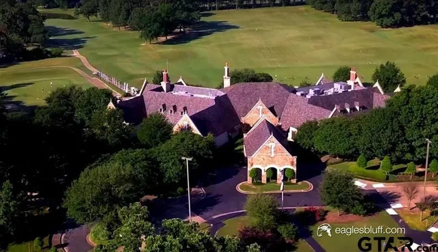 an aerial view of house with yard swimming pool and outdoor seating