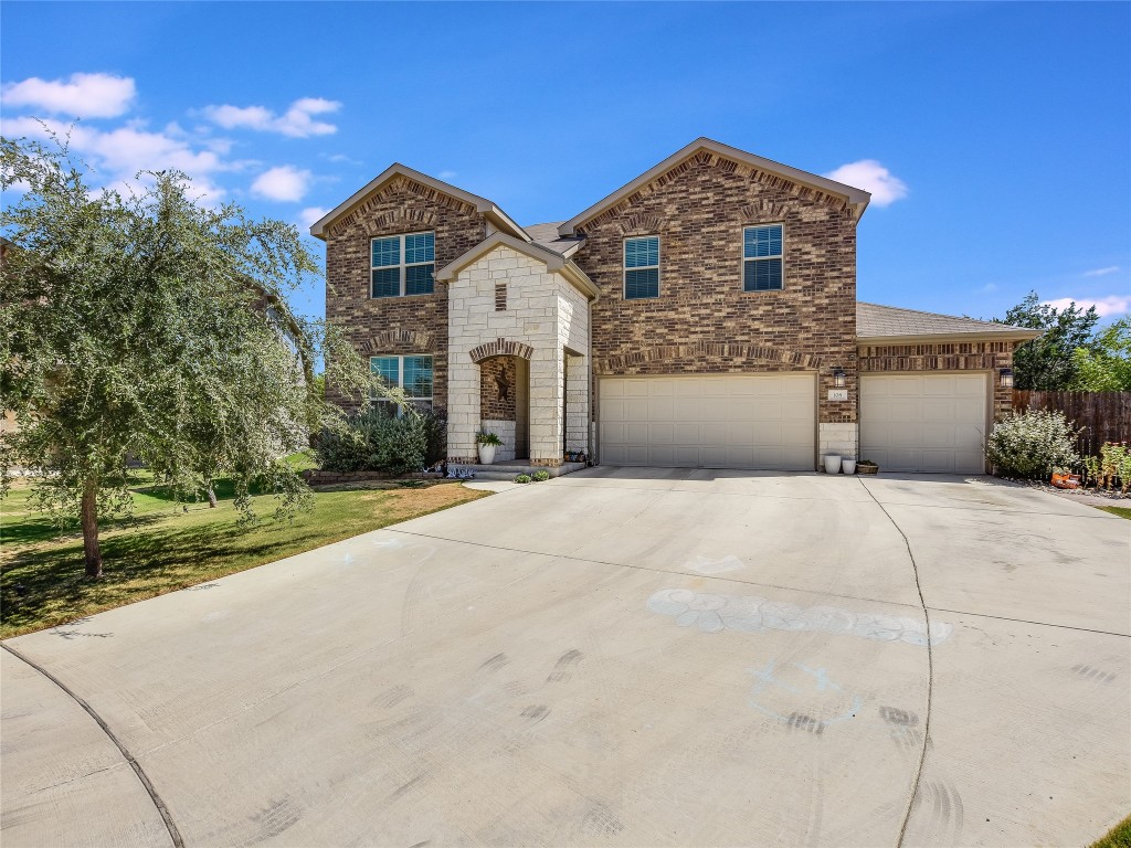 108 Caprock Cove Liberty Hill, TX 78642 - Photo 1 of 1 a front view of a house with a yard and garage