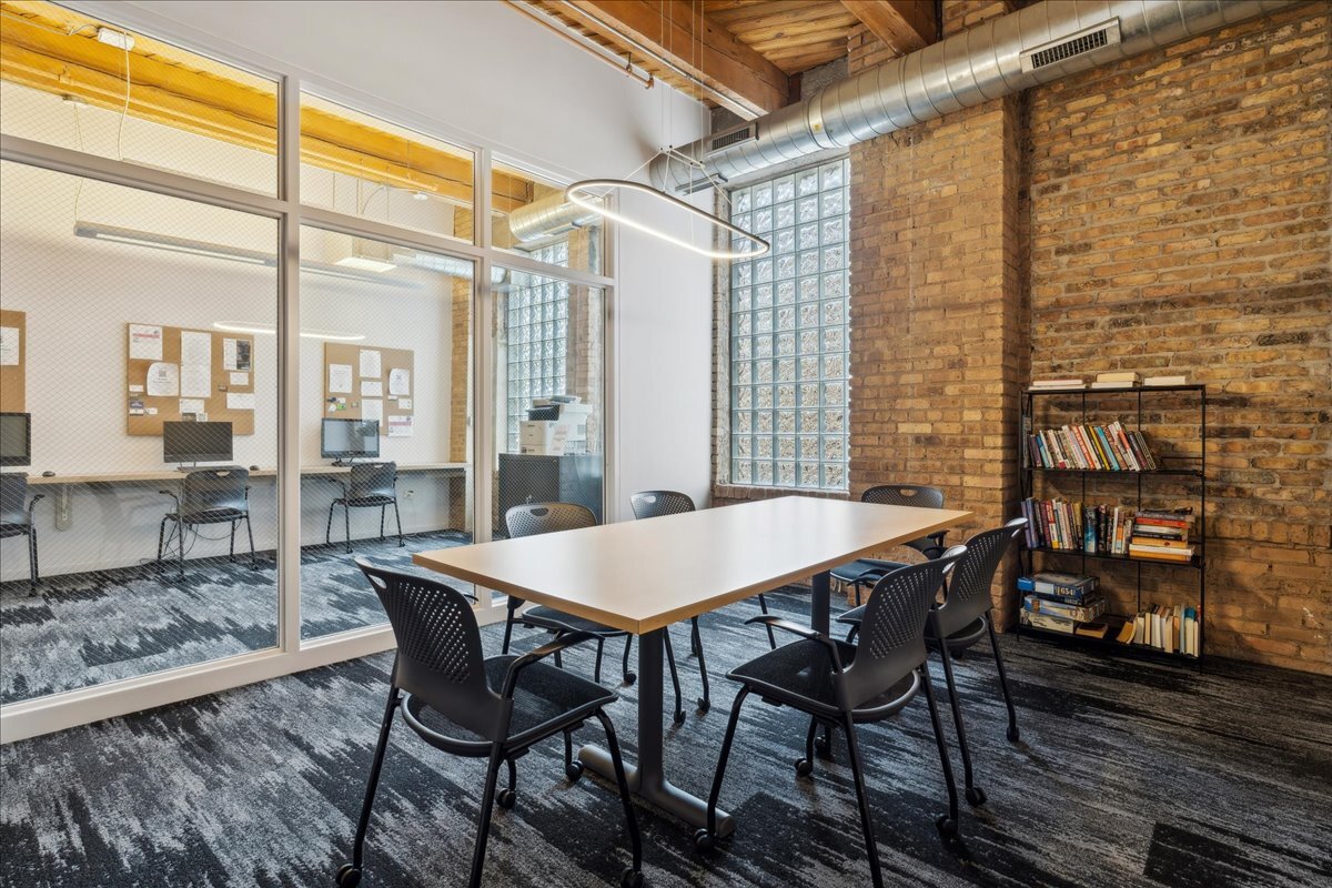 1040 West Adams Street, Unit 344 Chicago, IL 60607 - Photo 25 of 31 a view of a dining room with furniture window and wooden floor