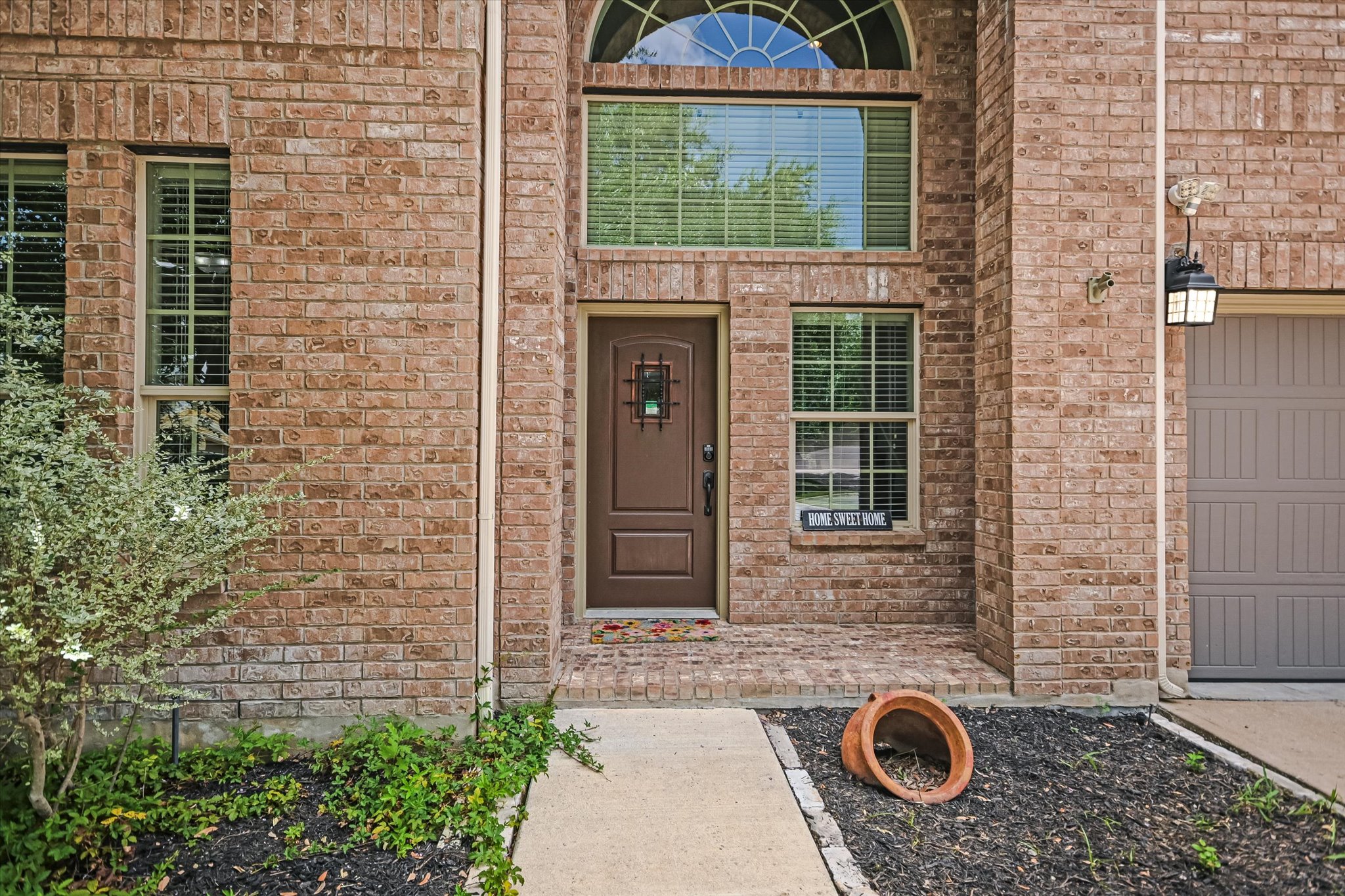 4623 Chestnut Meadows Bend Georgetown, TX 78626 - Photo 3 of 30 a brick house with a outdoor space
