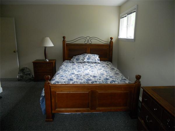 9 Golden Ball Road Weston, MA 02493 - Photo 26 of 27 a bed sitting in a bedroom next to a window