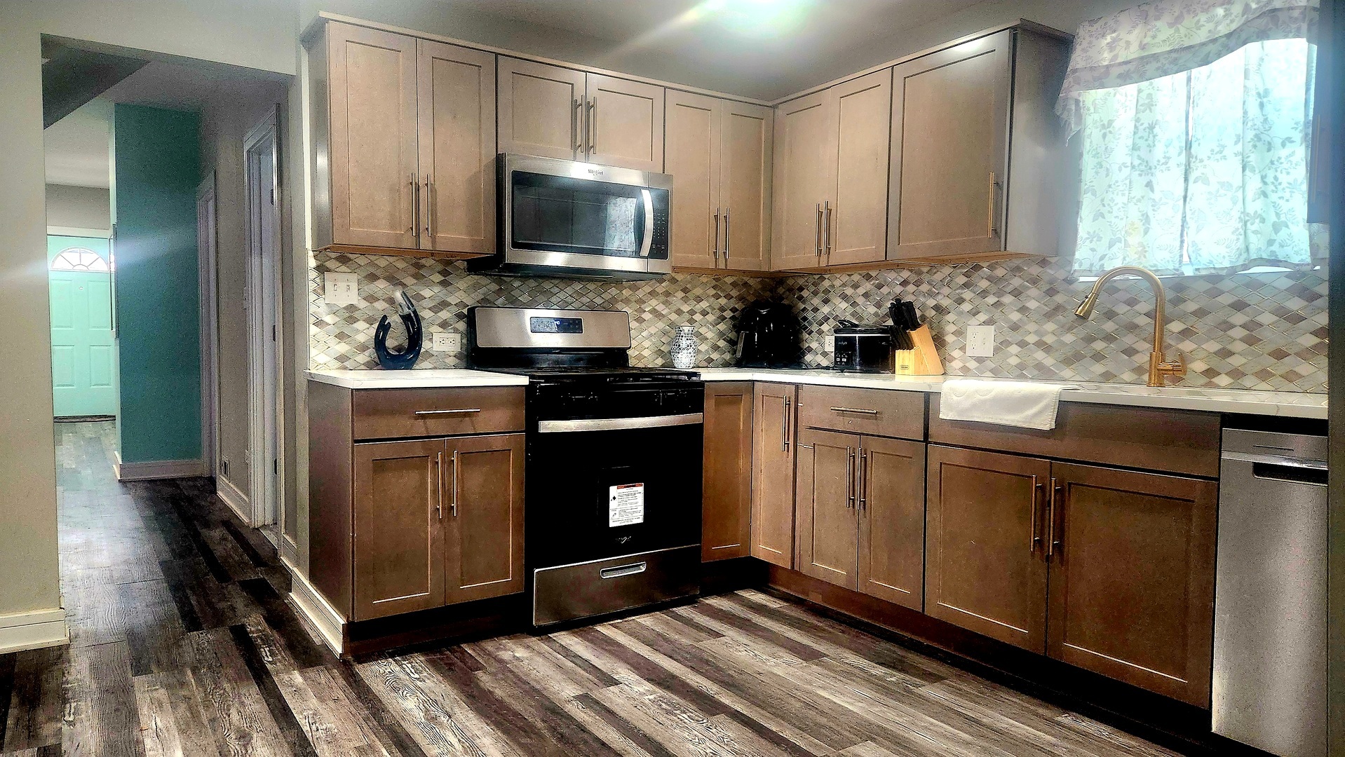 13331 South Calumet Avenue Chicago, IL 60827 - Photo 12 of 35 a kitchen with stainless steel appliances a sink cabinets and a window