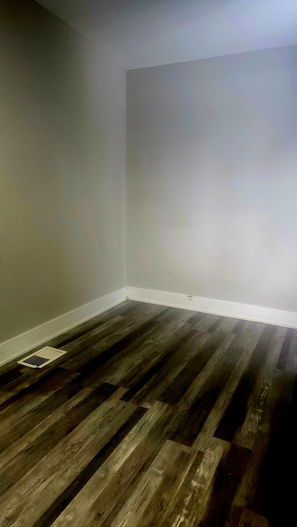 13331 South Calumet Avenue Chicago, IL 60827 - Photo 18 of 35 a view of a room with wooden floor