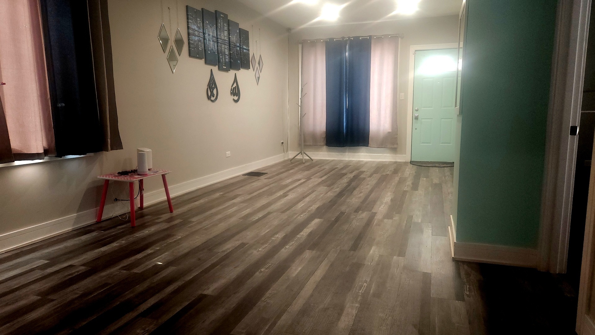 13331 South Calumet Avenue Chicago, IL 60827 - Photo 6 of 35 a view of an empty room and wooden floor