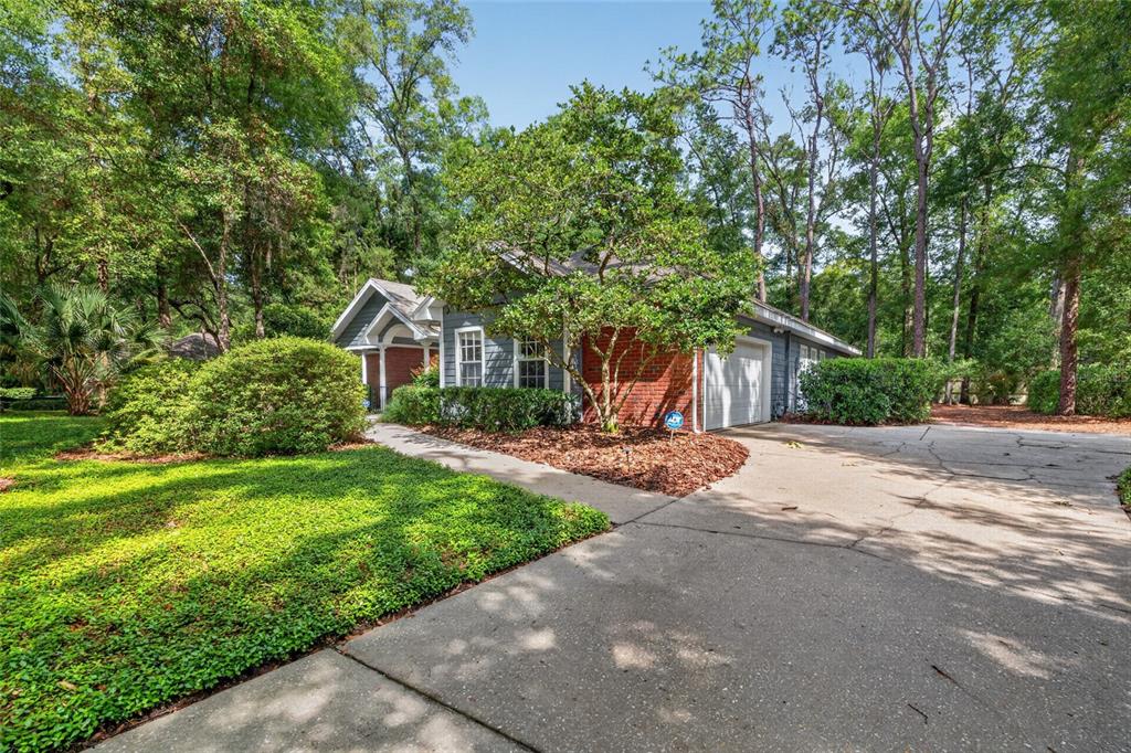9626 Southwest 53rd Road Gainesville, FL 32608 - Photo 2 of 23 a view of a house with backyard and sitting area
