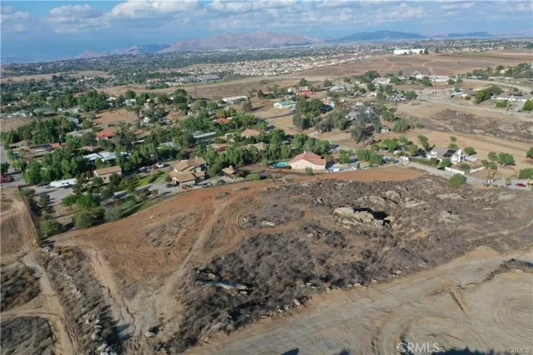 an aerial view of mountain with yard
