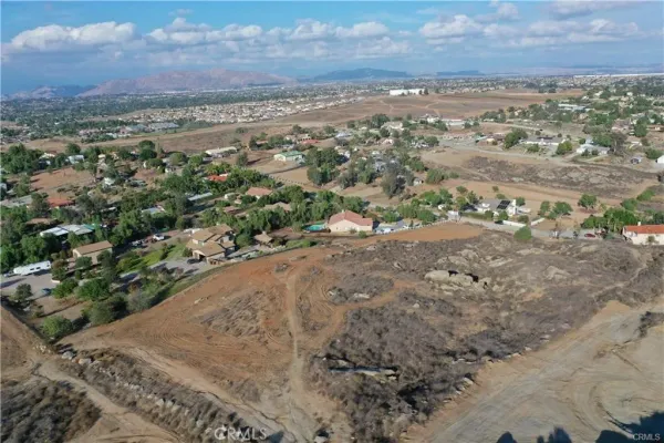an aerial view of mountain with yard