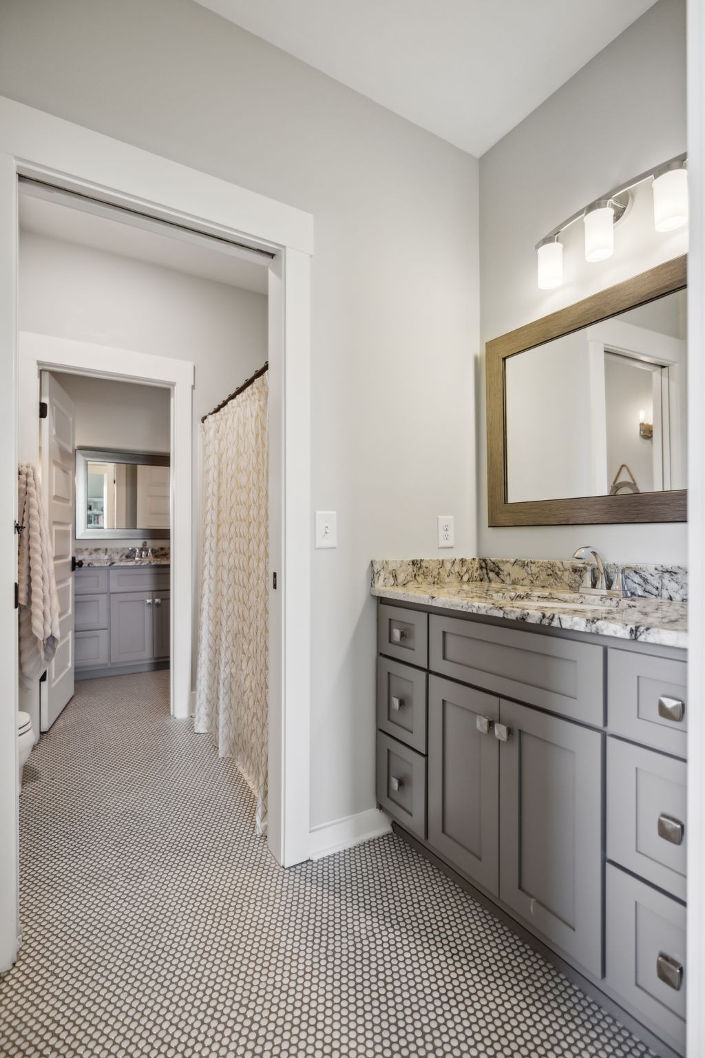 1236 Beechcroft Road Spring Hill, TN 37174 - Photo 45 of 70 a bathroom with a sink and a mirror