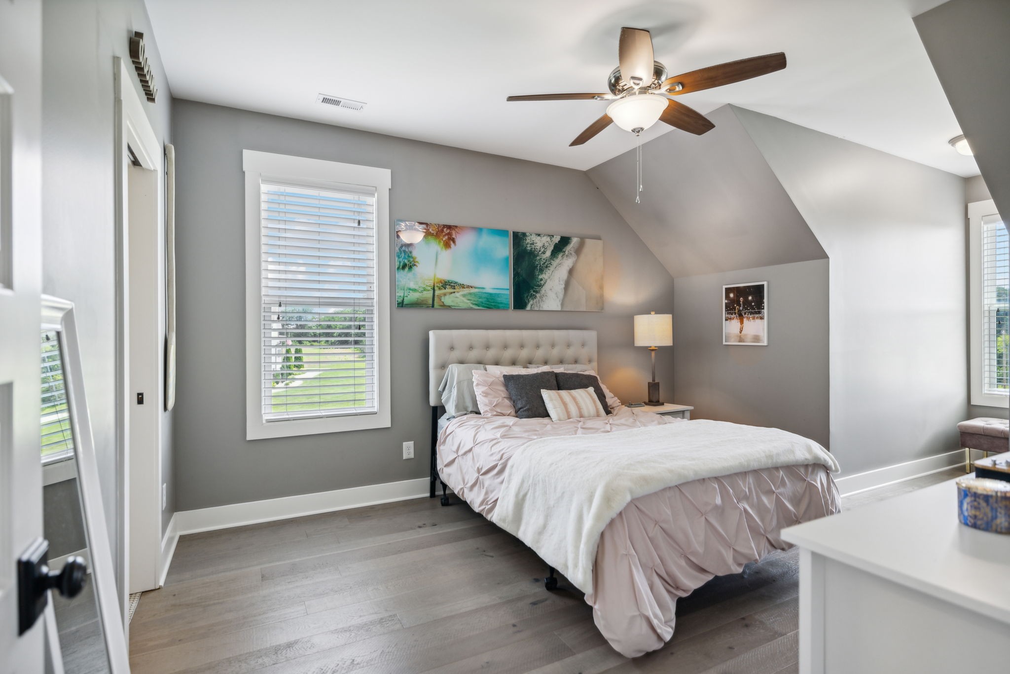 1236 Beechcroft Road Spring Hill, TN 37174 - Photo 48 of 70 a bedroom with a large bed chandelier and a window