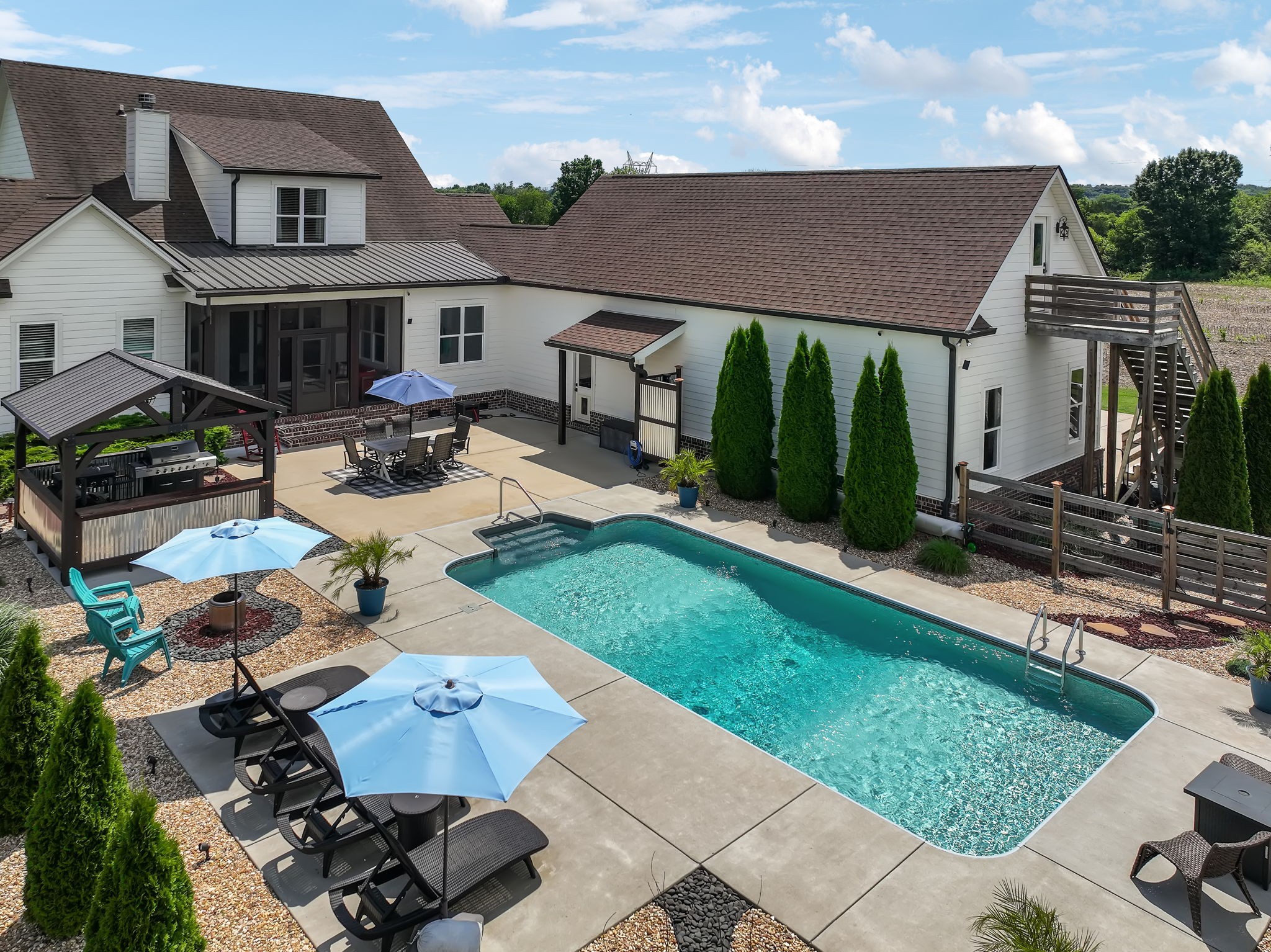 1236 Beechcroft Road Spring Hill, TN 37174 - Photo 60 of 70 a view of a house with backyard sitting area and garden