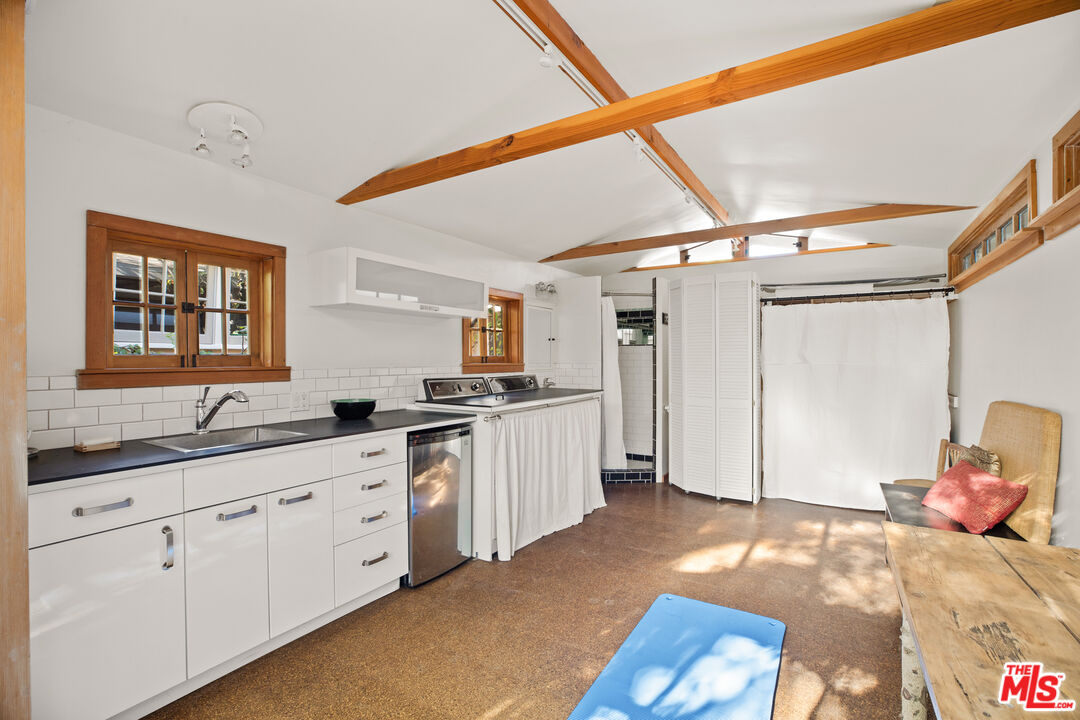 761 Palms Boulevard Venice, CA 90291 - Photo 21 of 26 a large white room with a large window and cabinets