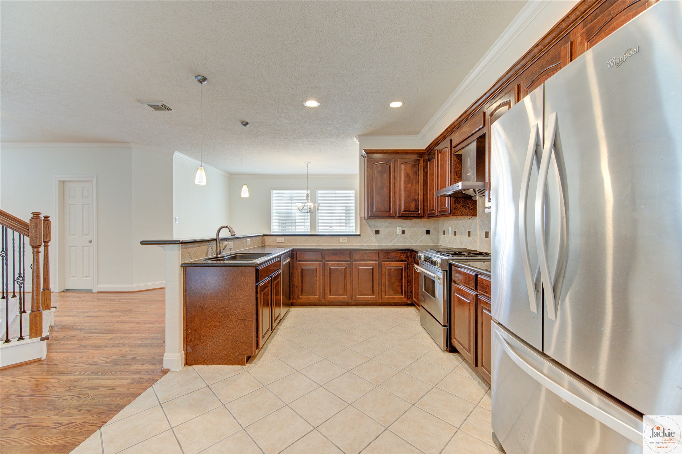 1322 Cohn Street Houston, TX 77007 - Photo 11 of 30 a kitchen with stainless steel appliances granite countertop a refrigerator and a stove