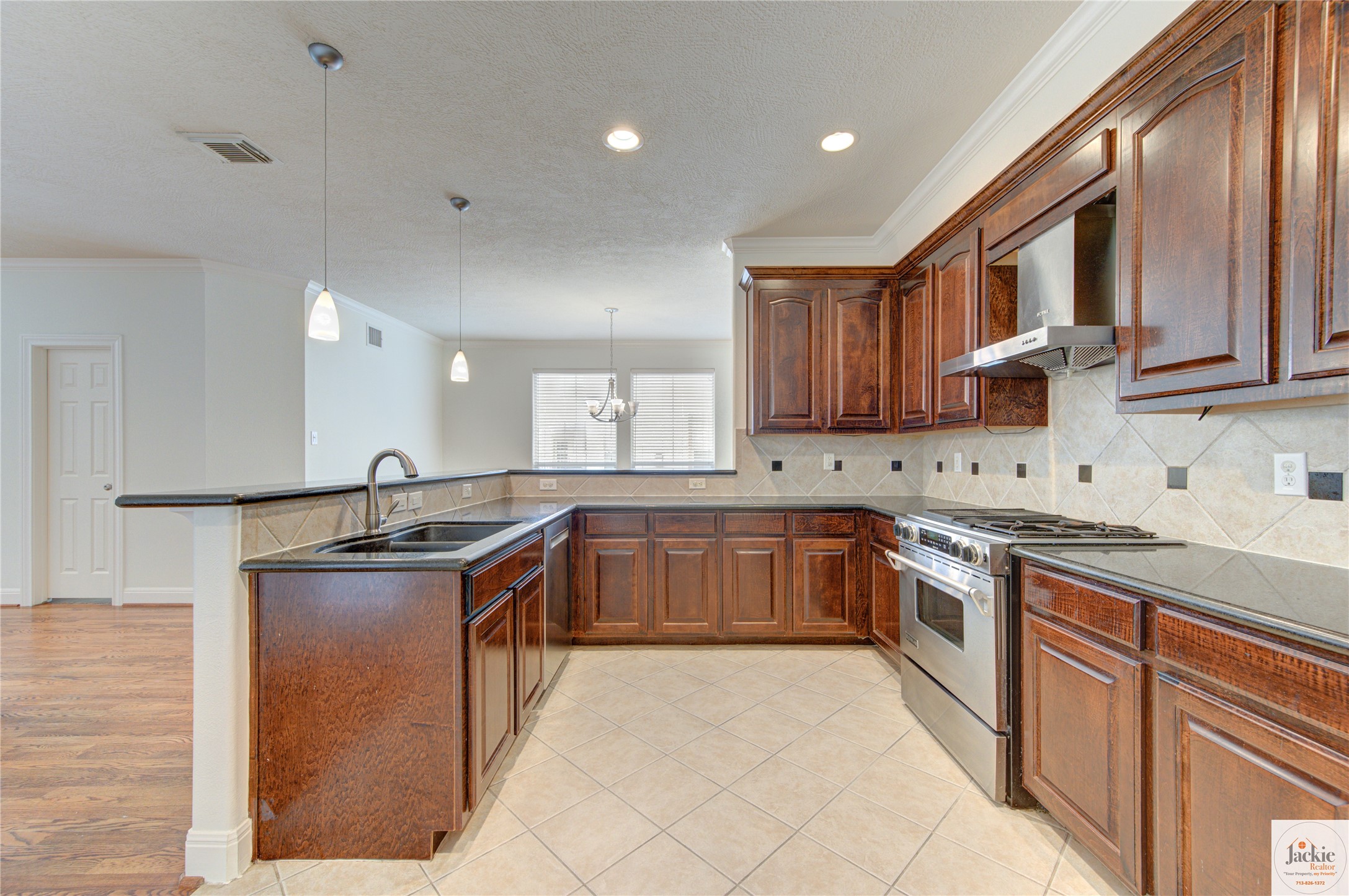 1322 Cohn Street Houston, TX 77007 - Photo 12 of 30 a kitchen with stainless steel appliances granite countertop a sink stove and cabinets
