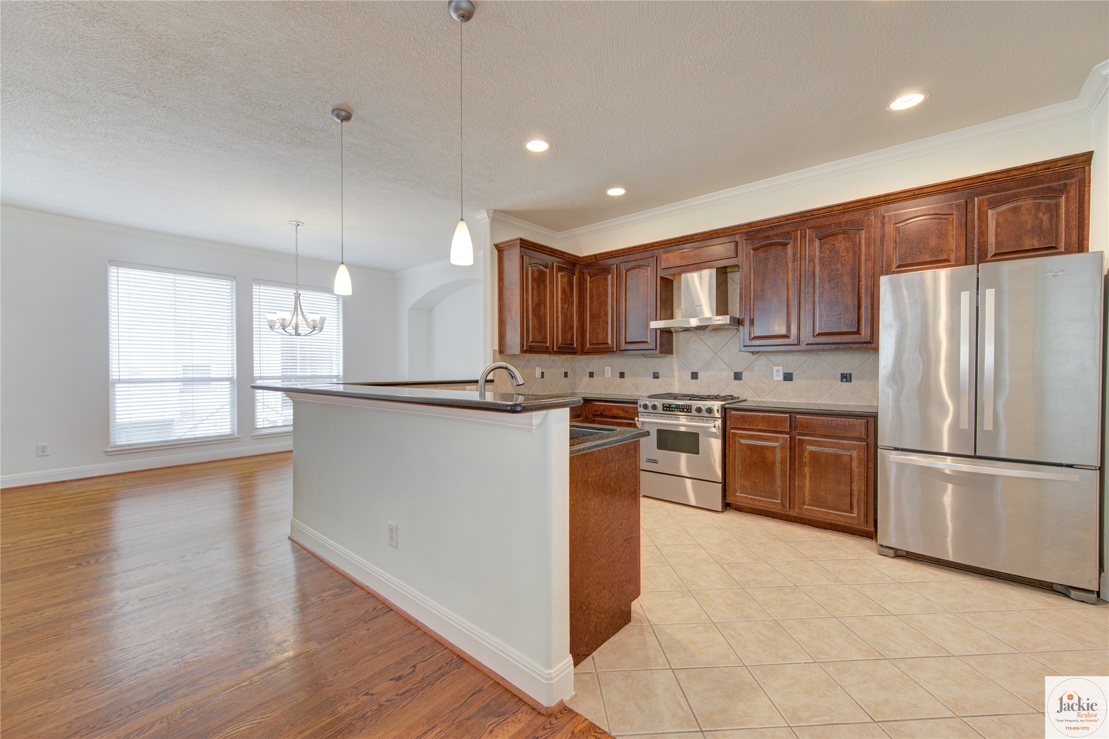 1322 Cohn Street Houston, TX 77007 - Photo 13 of 30 a kitchen with stainless steel appliances granite countertop a refrigerator sink and cabinets
