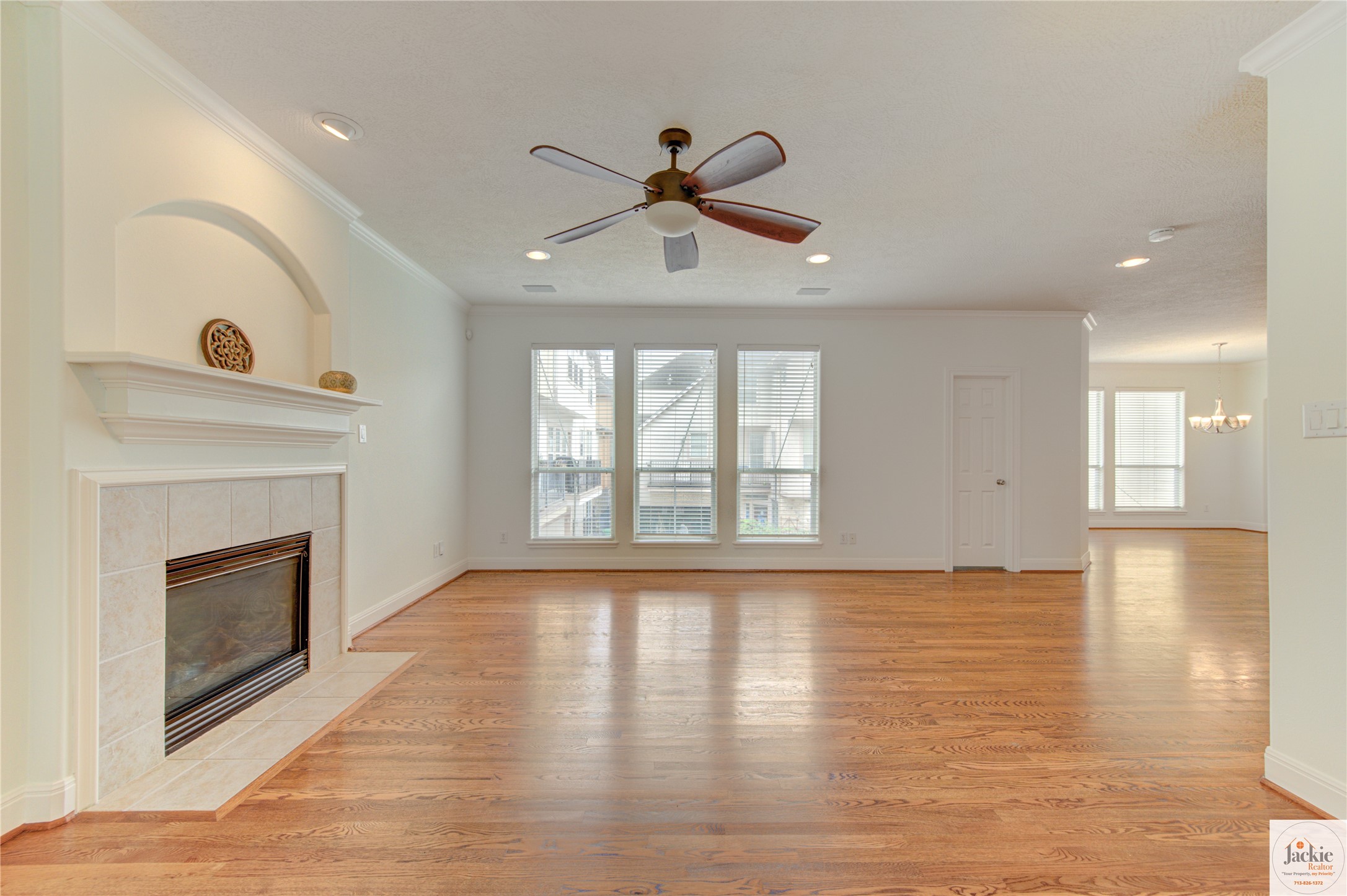 1322 Cohn Street Houston, TX 77007 - Photo 14 of 30 a view of an empty room with wooden floor and a fireplace