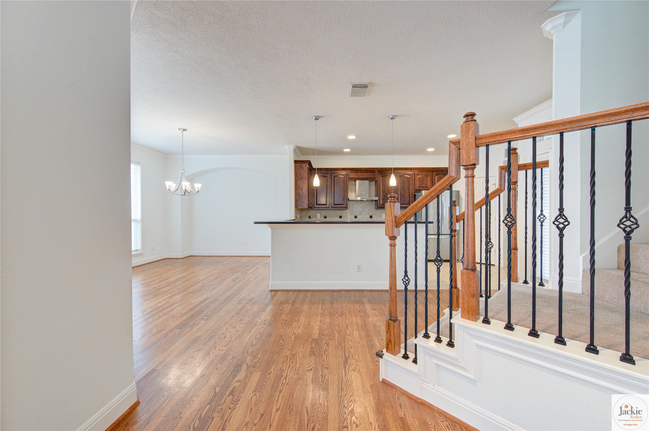 1322 Cohn Street Houston, TX 77007 - Photo 18 of 30 a view of a hallway with wooden floor and staircase