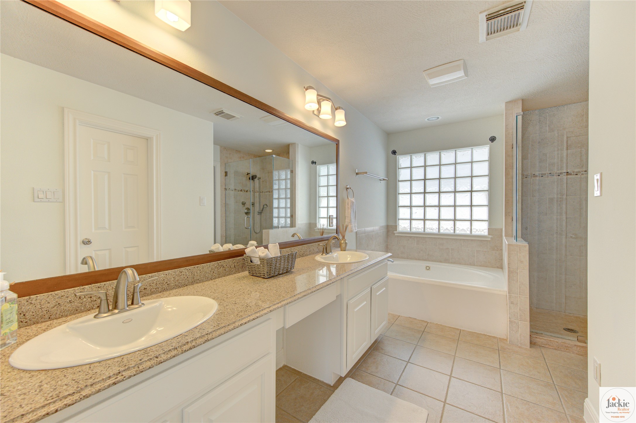 1322 Cohn Street Houston, TX 77007 - Photo 25 of 30 a spacious bathroom with a sink double vanity granite tub shower and a mirror