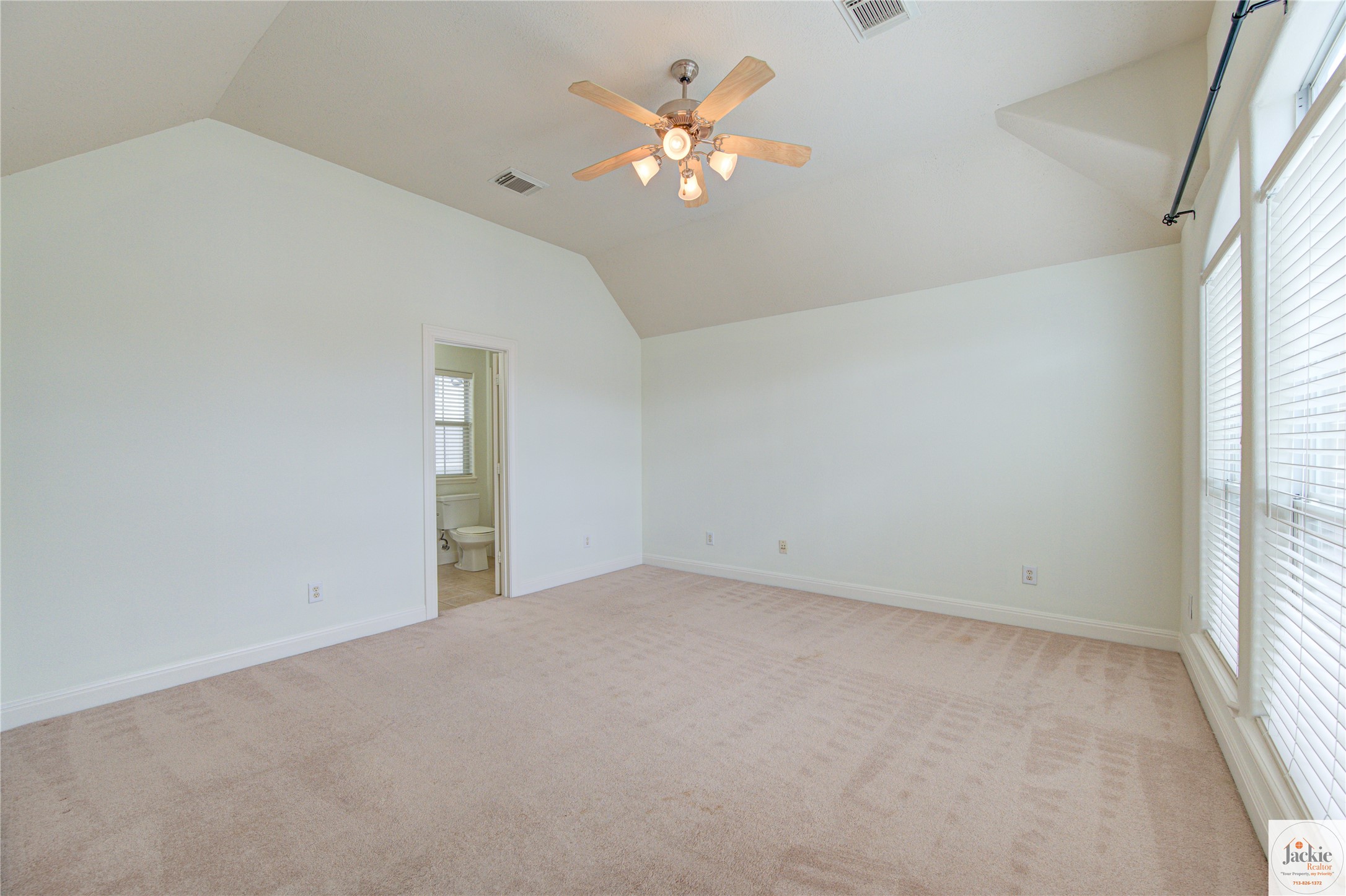 1322 Cohn Street Houston, TX 77007 - Photo 27 of 30 an empty room with a window and a chandelier fan