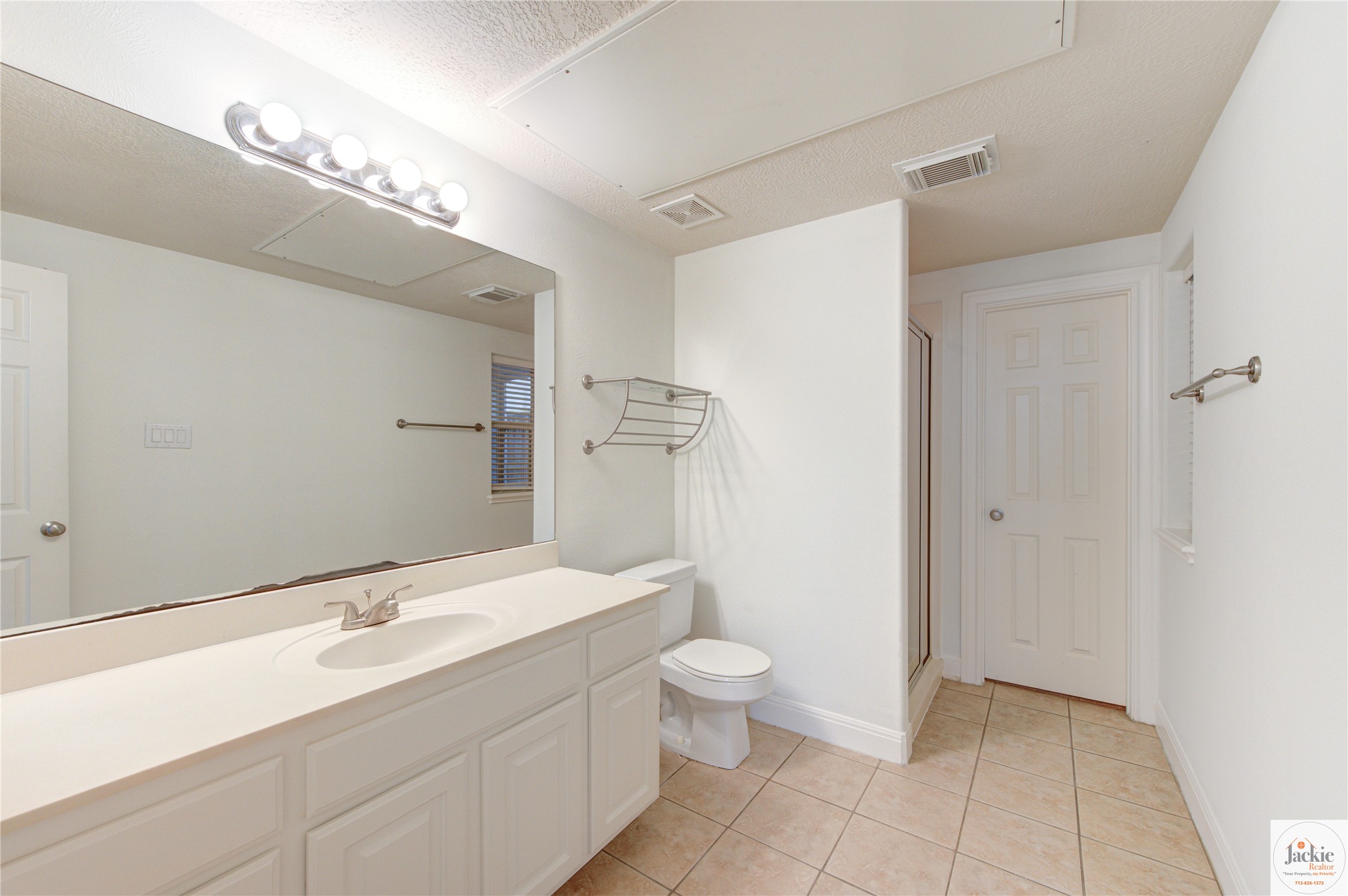 1322 Cohn Street Houston, TX 77007 - Photo 7 of 30 a bathroom with a double vanity sink mirror and toilet