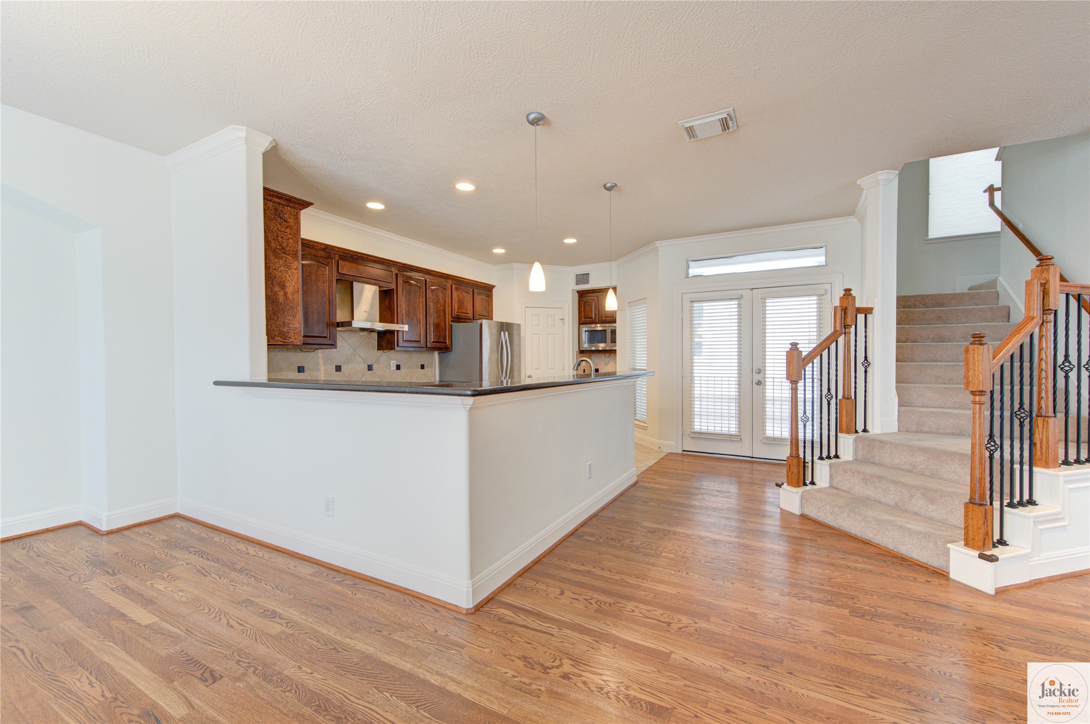 1322 Cohn Street Houston, TX 77007 - Photo 9 of 30 a view of a hallway with wooden floor and fence