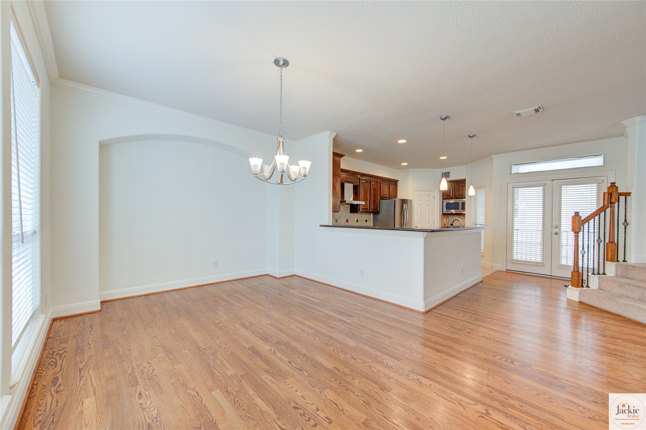 1322 Cohn Street Houston, TX 77007 - Photo 10 of 30 a view of a kitchen with a dishwasher cabinets and a wooden floor