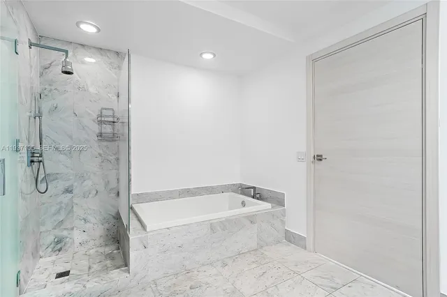 a view of bathroom with washer and dryer