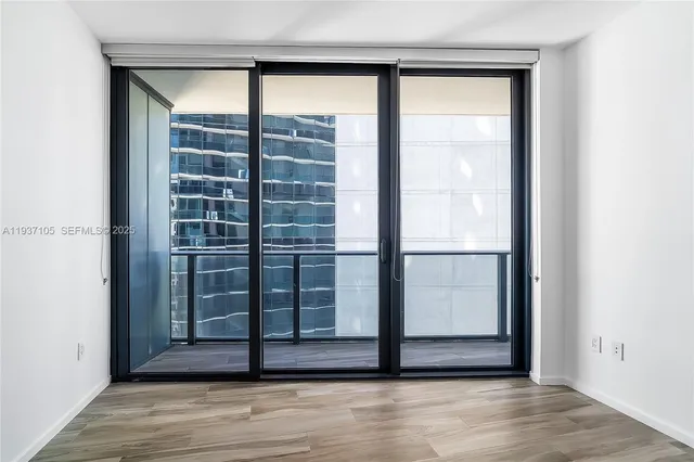 a view of hallway with wooden floor