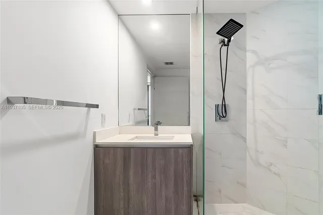 a view of balcony with a couple of potted plants