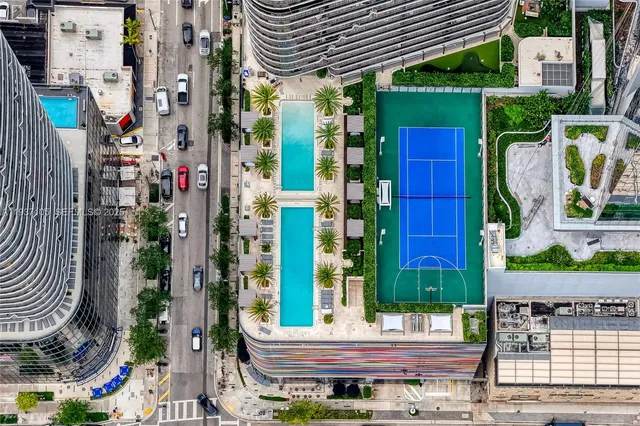 a view of a lake with tall buildings