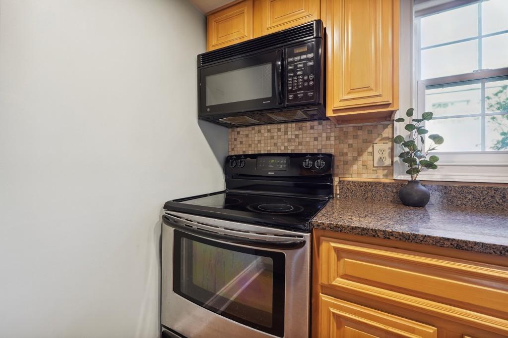 104 Rondak Circle Smyrna, GA 30080 - Photo 13 of 33 a kitchen with granite countertop cabinets stainless steel appliances and a counter space
