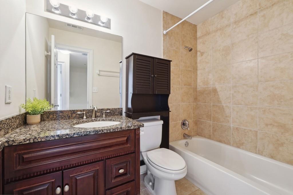 104 Rondak Circle Smyrna, GA 30080 - Photo 23 of 33 a bathroom with a granite countertop bathtub sink vanity mirror and toilet