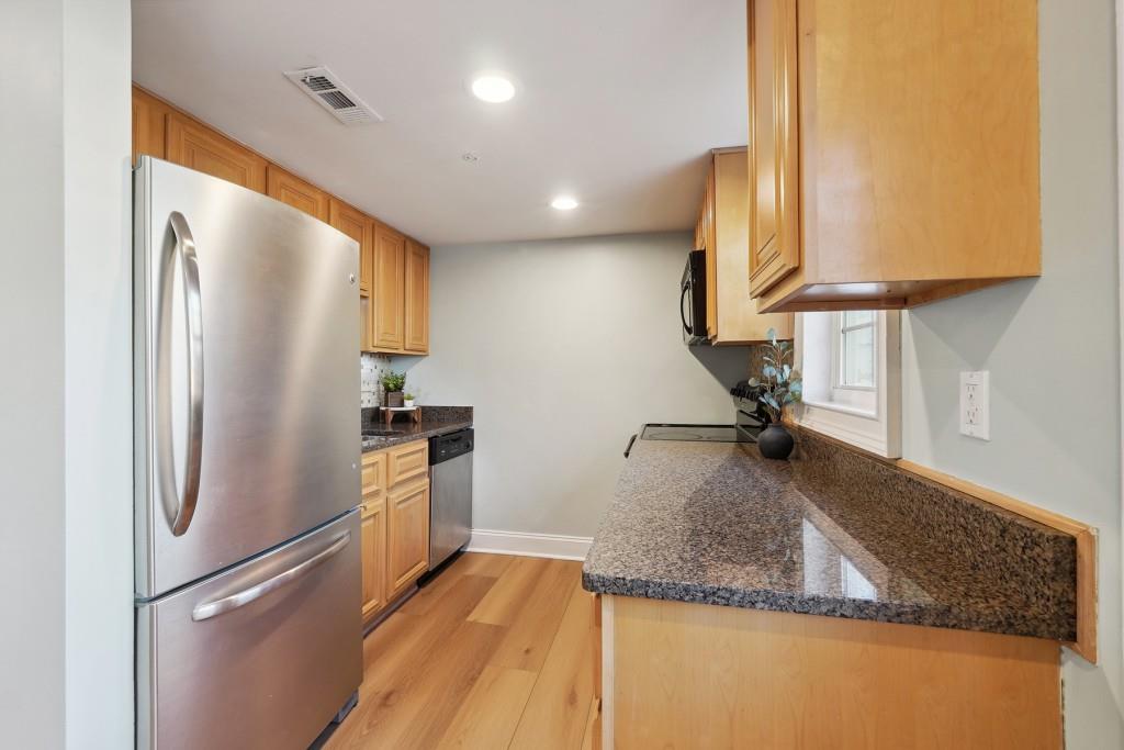 104 Rondak Circle Smyrna, GA 30080 - Photo 3 of 33 a kitchen with a refrigerator sink and stove