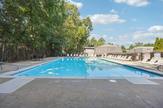 a view of swimming pool with a patio
