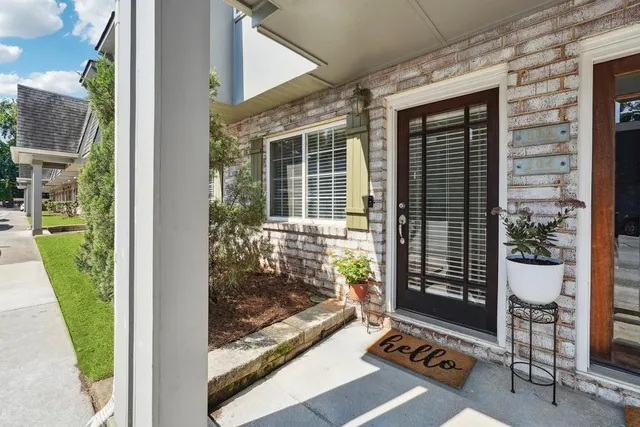 a view of porch with a door and chair